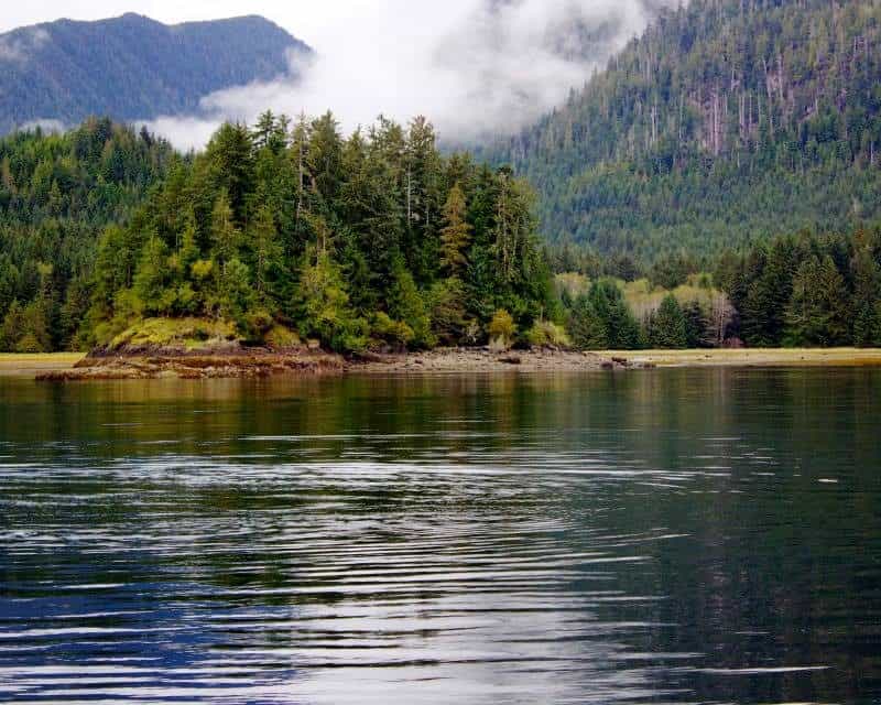 A small island on the edge of the world, nestled in the middle of a body of water.