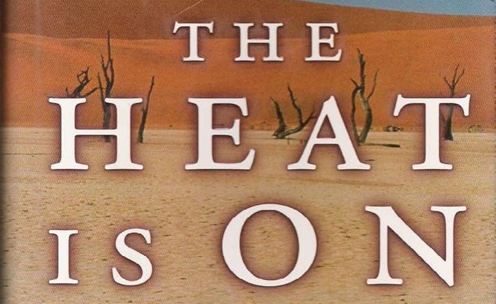 Text on a desert background reads, "The Heat is On," evoking the intense atmosphere reminiscent of 1997, amidst dry trees and sand.