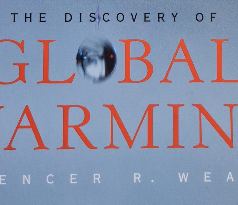 Book cover of the 2003 climate book "The Discovery of Global Warming" by Spencer R. Weart, featuring a blurred swinging pendulum above the word "GLOBAL." A compelling Book of the Year for understanding climate science.