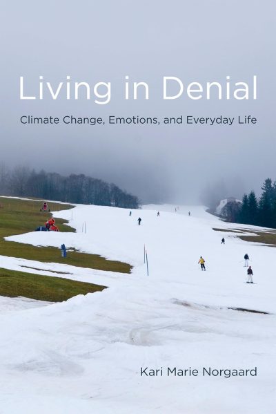 A snowy ski slope with patches of grass and several skiers under an overcast sky hints at changing seasons; Book of the Year 2011 and author text overlay this striking Climate Book image.