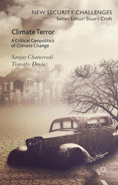 Cover of the Climate Book "Climate Terror" showing a cracked, dry landscape with an old car in the foreground and a hazy city skyline in the background under cloudy skies. Named by many as a potential Climate Book of the Year in 2015, its powerful imagery captures the stark realities at the heart of climate discussions.